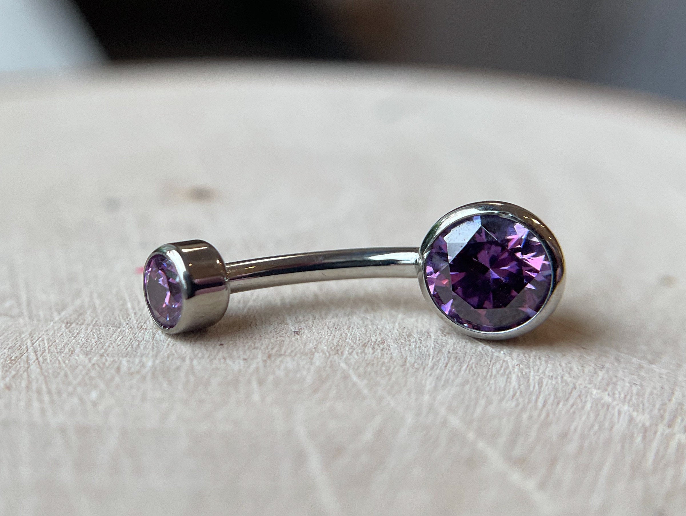 Purple CZ Bezel Navel Curve by Industrial Strength (4mm x 6mm)